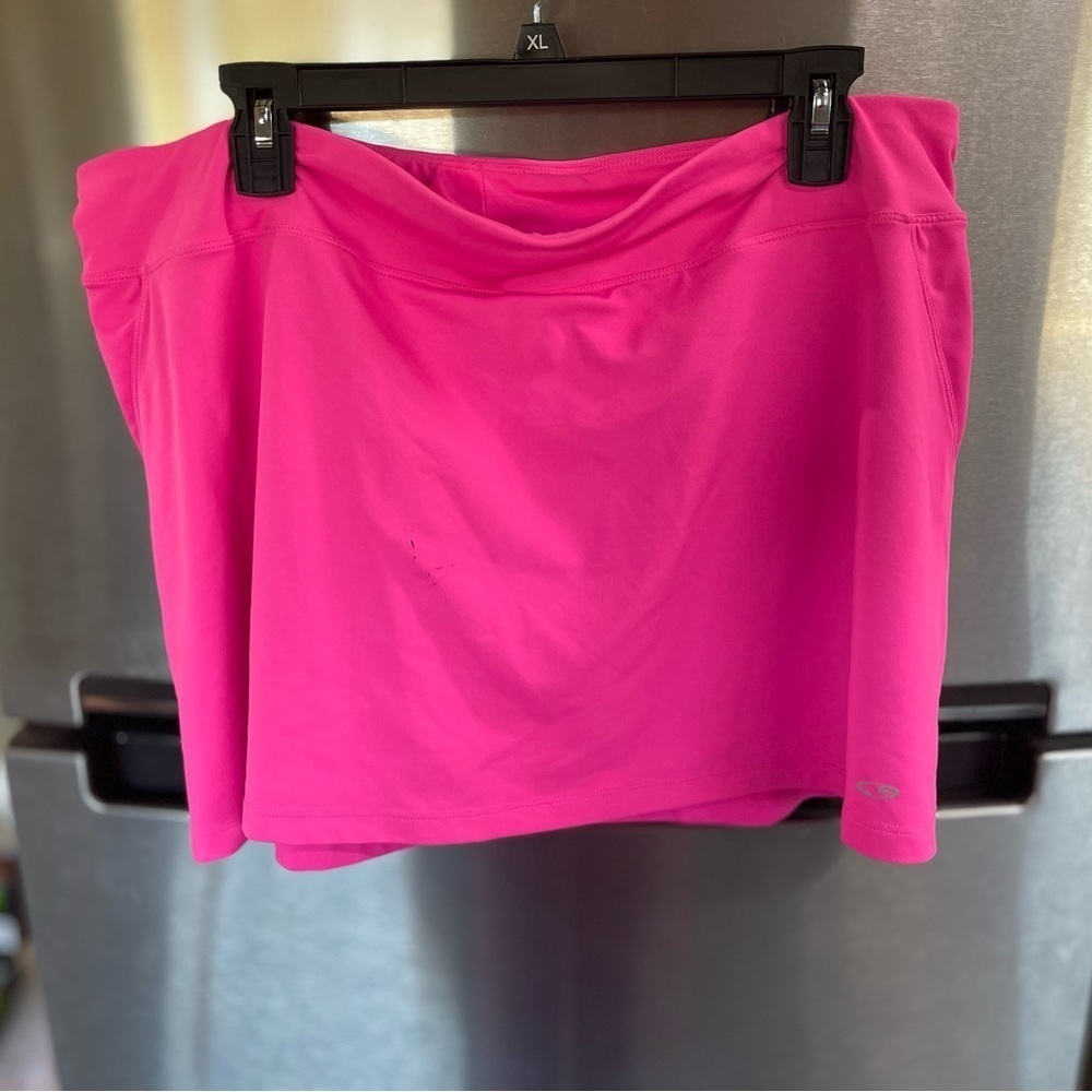 Champion skort woman XL‎ hot pink logo on front hem. Key pocket, snags in front